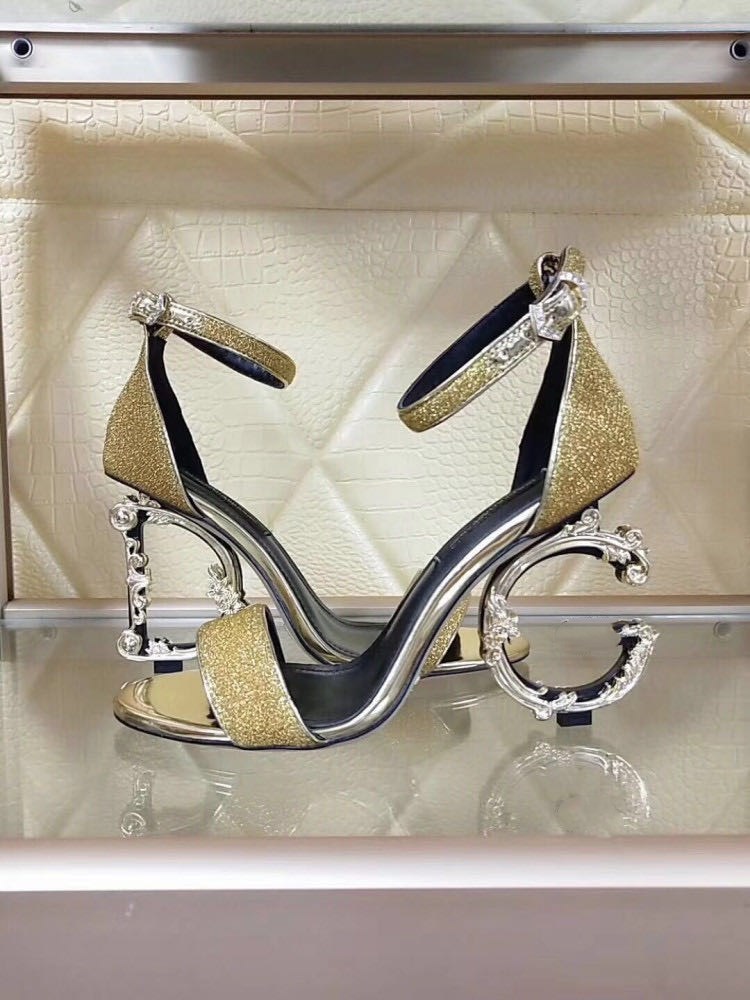Gold high heels.