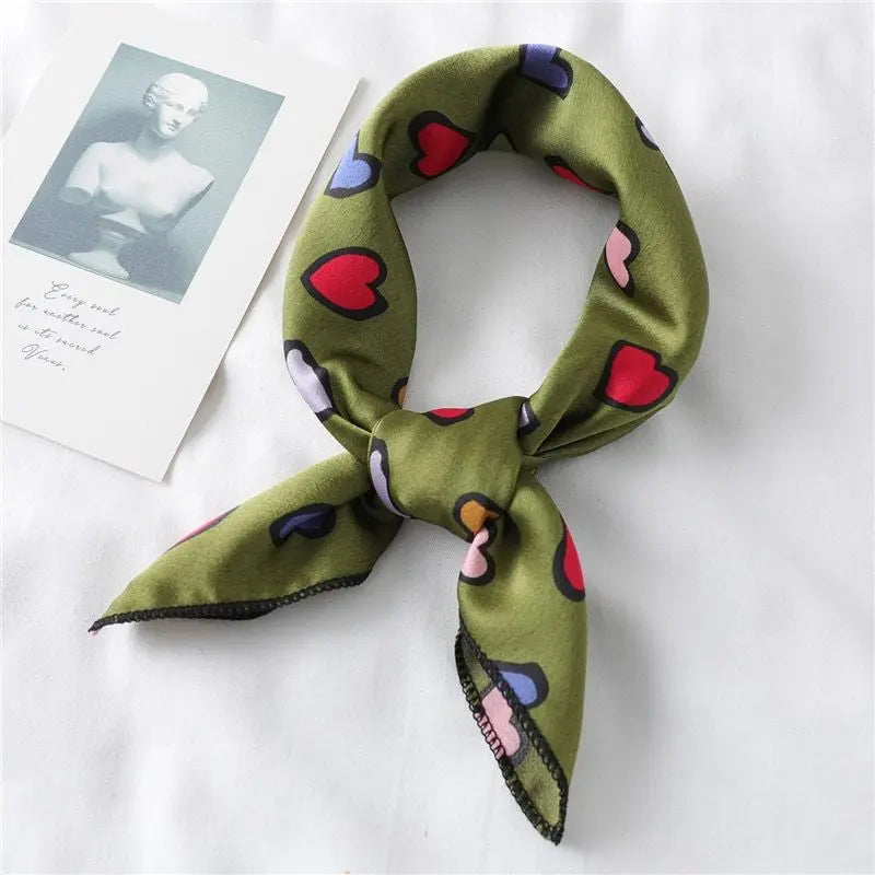 Elegant silk scarf featuring a charming heart print, perfect fashion accessory for women seeking stylish looks.