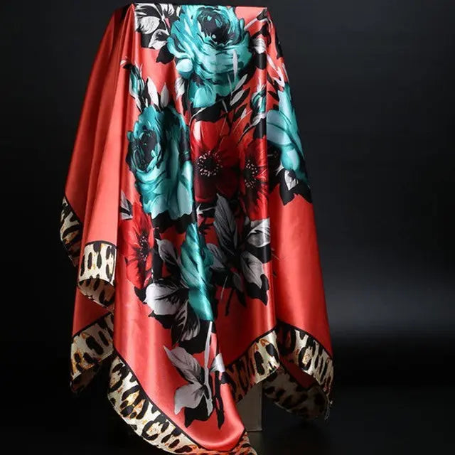 Elegant silk scarf featuring a stylish leopard print pattern, perfect for fashion-forward accessories.