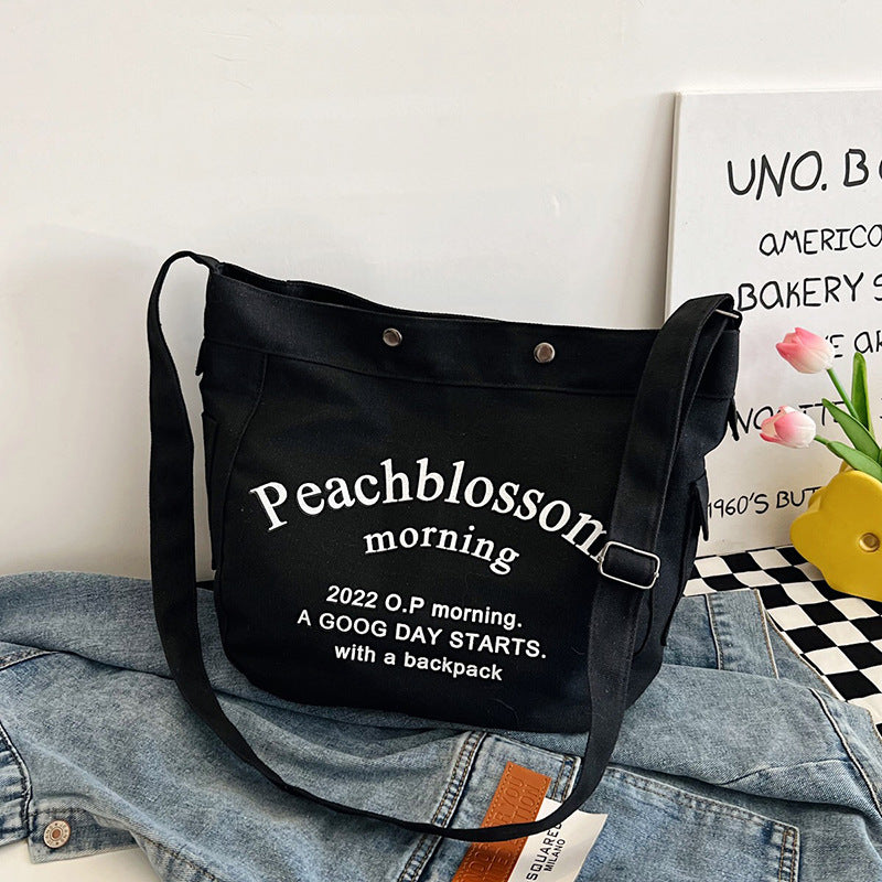 Letter canvas bag, women's new trendy tote bag, student class large capacity crossbody bag.