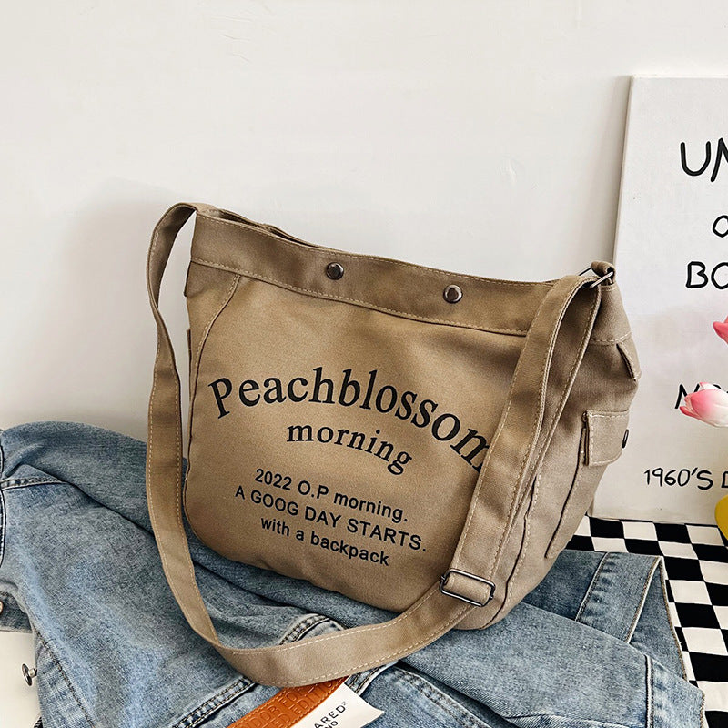 Letter canvas bag, women's new trendy tote bag, student class large capacity crossbody bag.