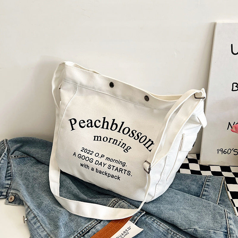 Letter canvas bag, women's new trendy tote bag, student class large capacity crossbody bag.