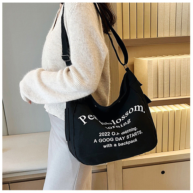 Letter canvas bag, women's new trendy tote bag, student class large capacity crossbody bag.