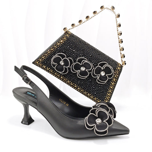 <img src="https://genacampbell.shop/images/le-saint-fargeau-escarpins-sac.jpg" alt="Le Saint-Fargeau · Ensemble escarpins à fleurs & sac bijou coordonné pour femme · Création Gena Campbell · Escarpins à bout pointu et talon aiguille ≈9 cm · Décoration florale brodée à la main · Matière : cuir synthétique rembourré · Sac rigide avec anse bijou et fermoir stylisé · Coloris : noir, bleu, marron, vert foncé, or, pêche, rouge rosé, blanc · Pointures du 38 au 43 · Élégance florale pour cérémonie, soirée ou allure